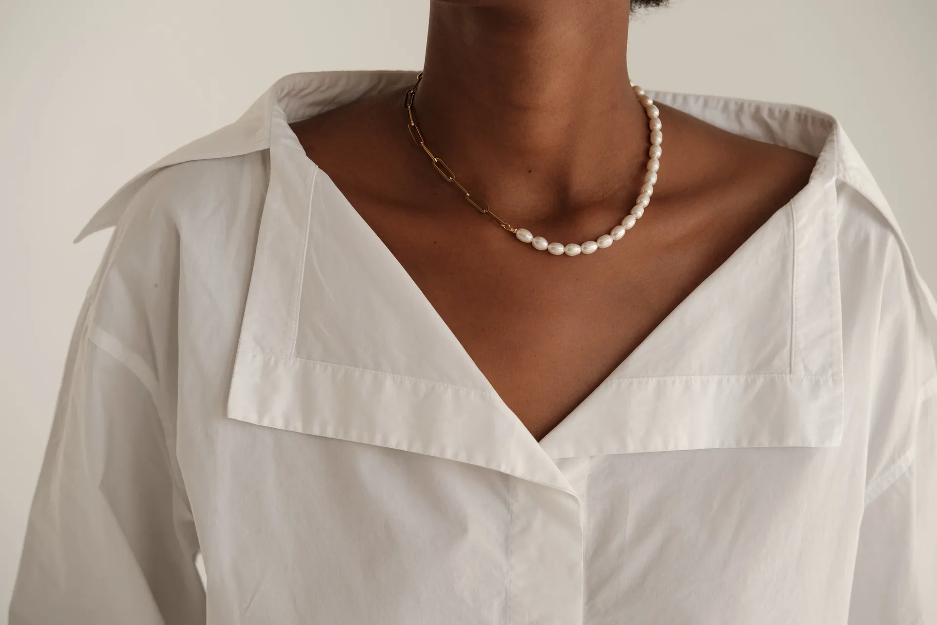 Maison Jolie Aesthetics client in a white blouse